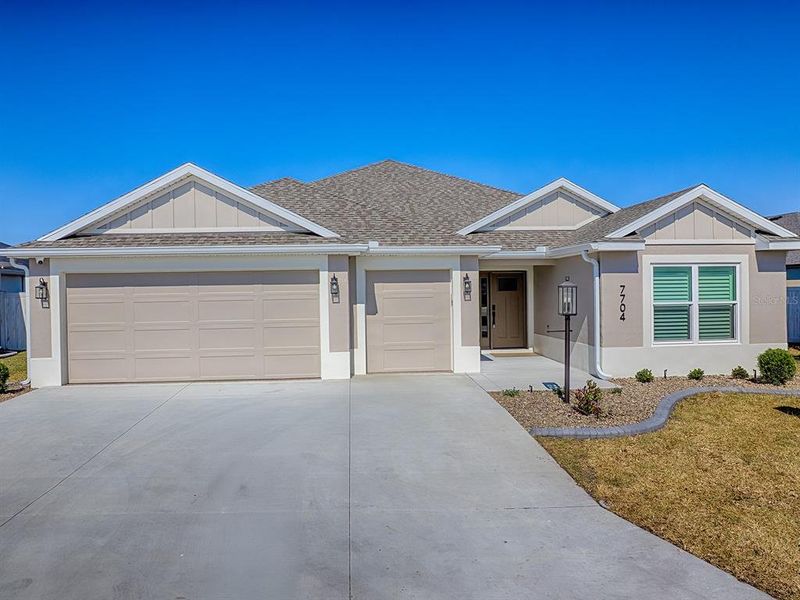 Front exterior of a new home in , The Villages, FL, highlighting curb appeal (Image 27). Front exterior of a new home in , The Villages, FL, highlighting curb appeal (Image 27).