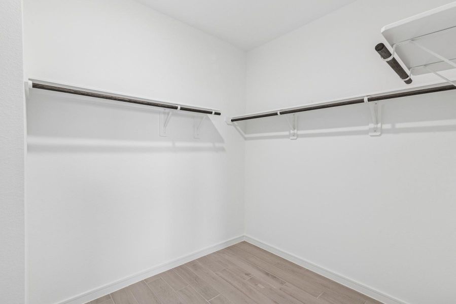 Walk-in closet in the primary suite Walk-in closet in the primary suite