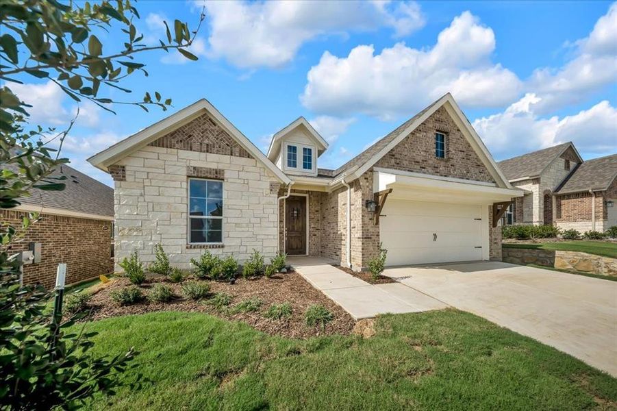 Front exterior of a new home in Liberty Pointe, Gainesville, TX, highlighting curb appeal (Image 18).