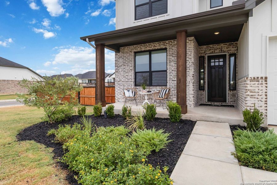 Front exterior of a new home in Woodbridge Farms, La Vernia, TX, highlighting curb appeal (Image 29).