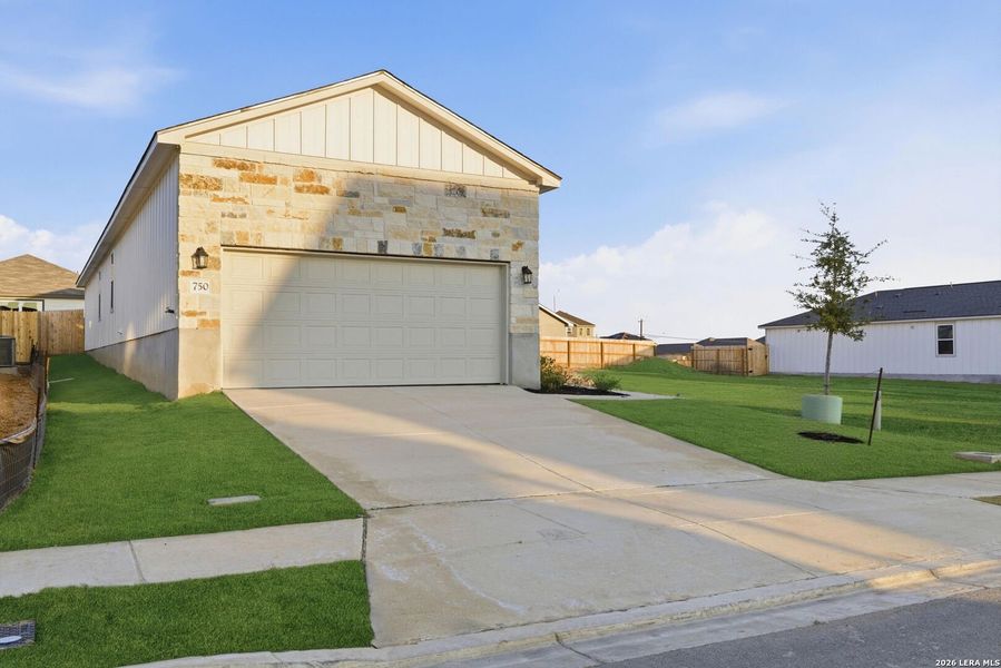 Front exterior of a new home in Highland Ridge, San Antonio, TX, highlighting curb appeal (Image 17).