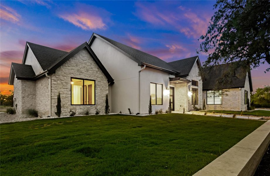 Front exterior of a new home in , Dripping Springs, TX, highlighting curb appeal (Image 19). Front exterior of a new home in , Dripping Springs, TX, highlighting curb appeal (Image 19).