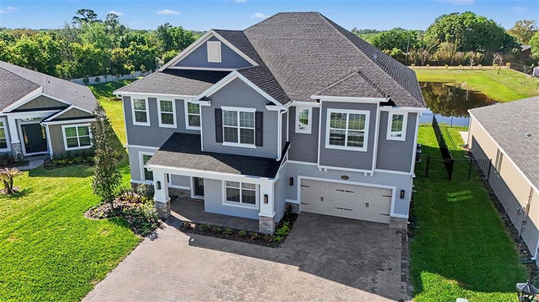 Front exterior of a new home in , Oviedo, FL, highlighting curb appeal (Image 23).