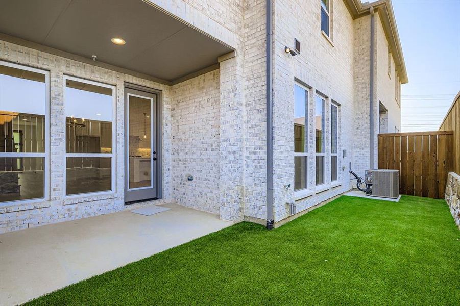 View of exterior entry with a patio and brick siding View of exterior entry with a patio and brick siding