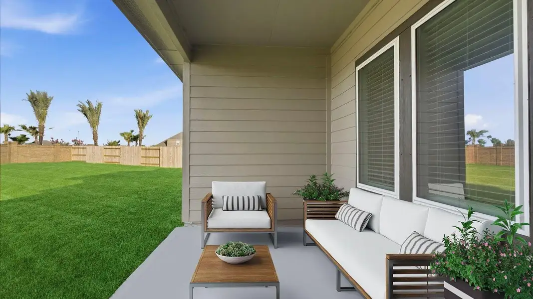 Outdoor covered patio with seating area overlooking a well-maintained lawn, perfect for relaxation. Outdoor covered patio with seating area overlooking a well-maintained lawn, perfect for relaxation.