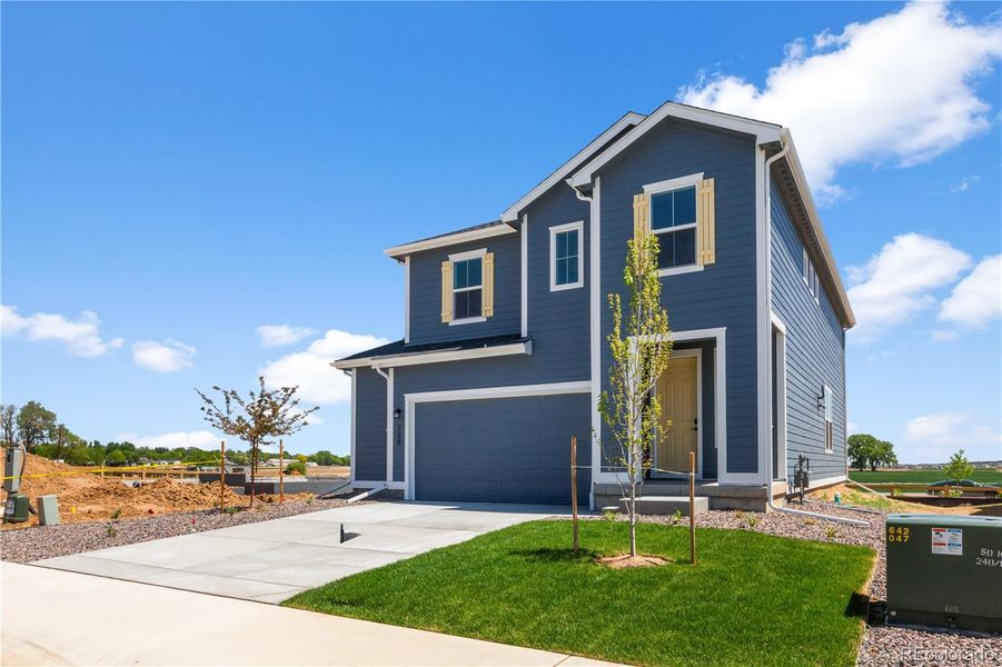 Front exterior of a new home in Granary, Johnstown, CO, highlighting curb appeal (Image 2). Front exterior of a new home in Granary, Johnstown, CO, highlighting curb appeal (Image 2).