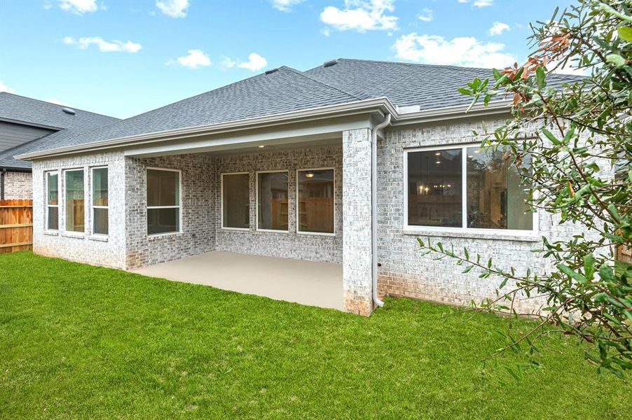 Fully sodded and fenced rear yard with sprinklers & full gutters.  All brick exterior.