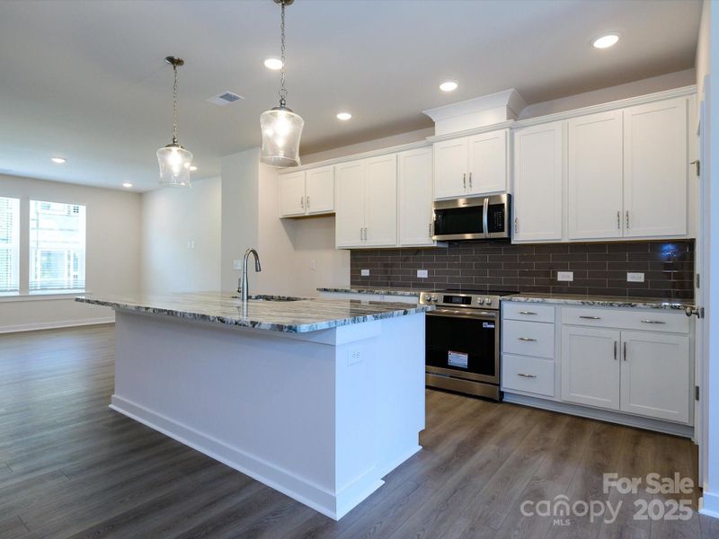 Furnished interior view inside a new home in Central Living at Craig, Charlotte (Image 6).