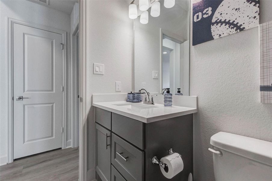 Modern bathroom with a sleek vanity featuring ample storage, a stylish mirror with overhead lighting, and a neutral color palette. Perfect for a contemporary home. Modern bathroom with a sleek vanity featuring ample storage, a stylish mirror with overhead lighting, and a neutral color palette. Perfect for a contemporary home.