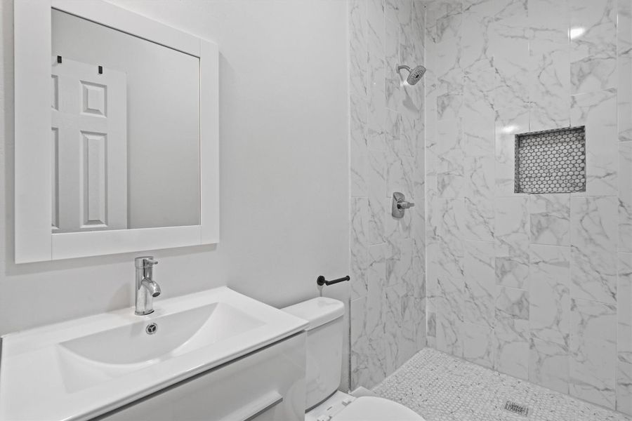 Secondary bathroom, fully tiled stand alone shower