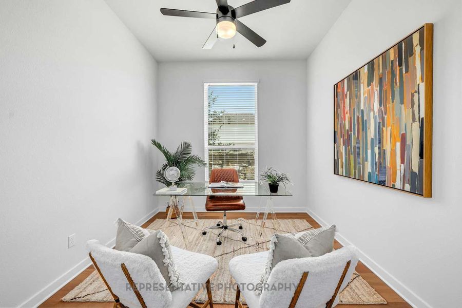 Office space featuring wood finished floors and a ceiling fan Office space featuring wood finished floors and a ceiling fan