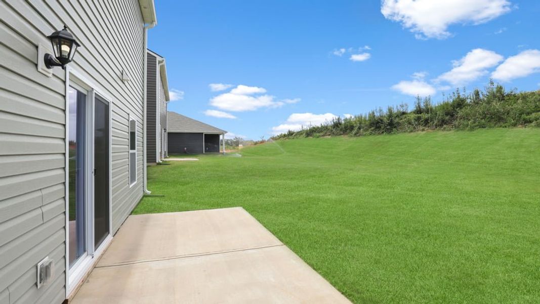 Exterior details and patio area of a home in Treemont Commons, Wellford (Image 23).