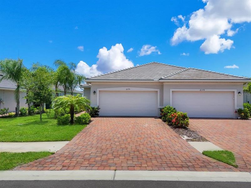 Front exterior of a new home in , Naples, FL, highlighting curb appeal (Image 23). Front exterior of a new home in , Naples, FL, highlighting curb appeal (Image 23).