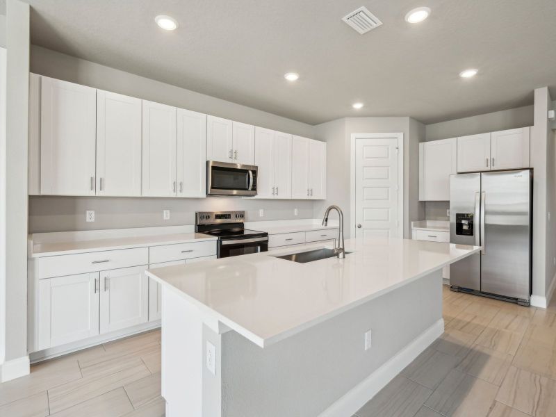Furnished interior view inside a new home in Brystol at Wylder - Reserve Series, Port St. Lucie (Image 7).