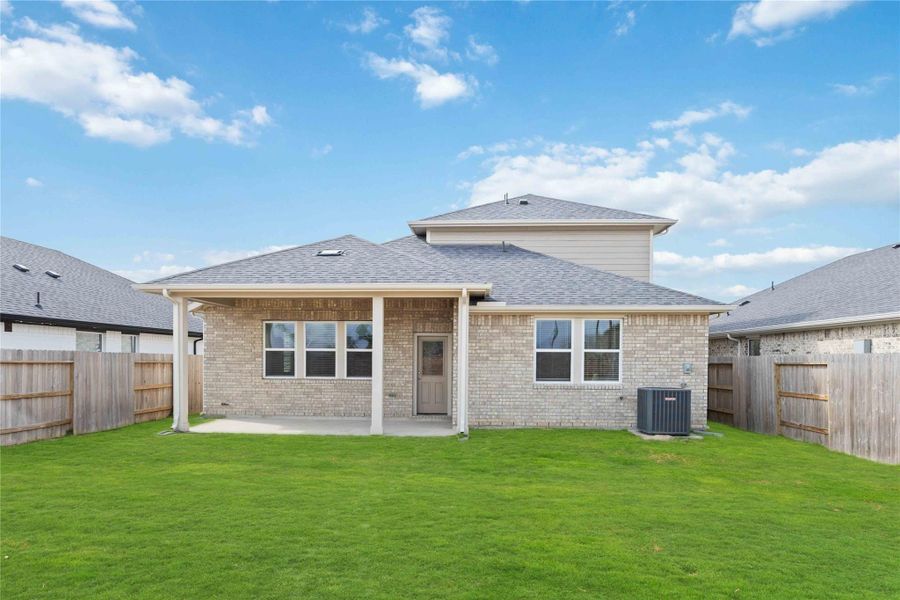 Exterior details and patio area of a home in Sunterra, Katy (Image 3).