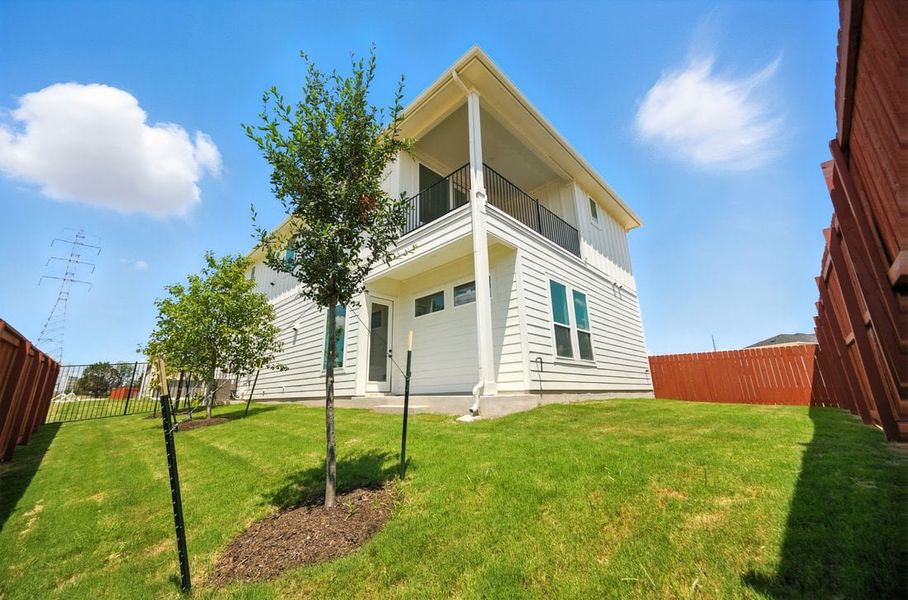 Front exterior of a new home in Foxfield, Austin, TX, highlighting curb appeal (Image 14). Front exterior of a new home in Foxfield, Austin, TX, highlighting curb appeal (Image 14).