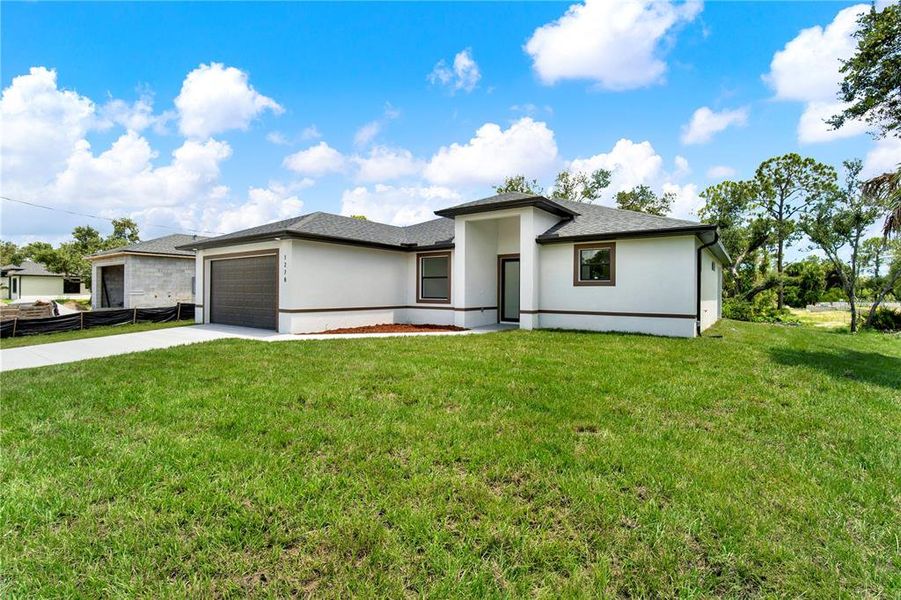 Front exterior of a new home in , Port Charlotte, FL, highlighting curb appeal (Image 28).