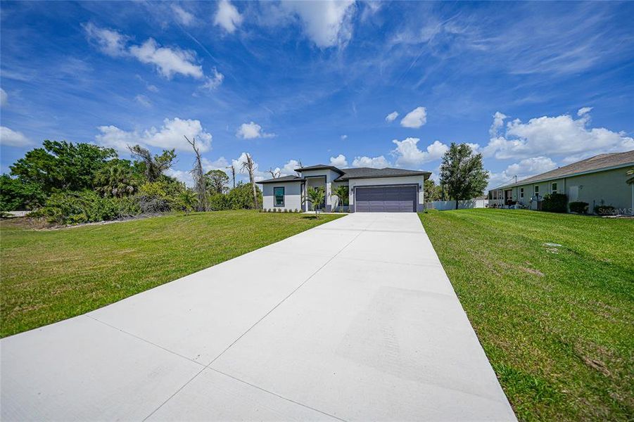 Front exterior of a new home in , Port Charlotte, FL, highlighting curb appeal (Image 28).