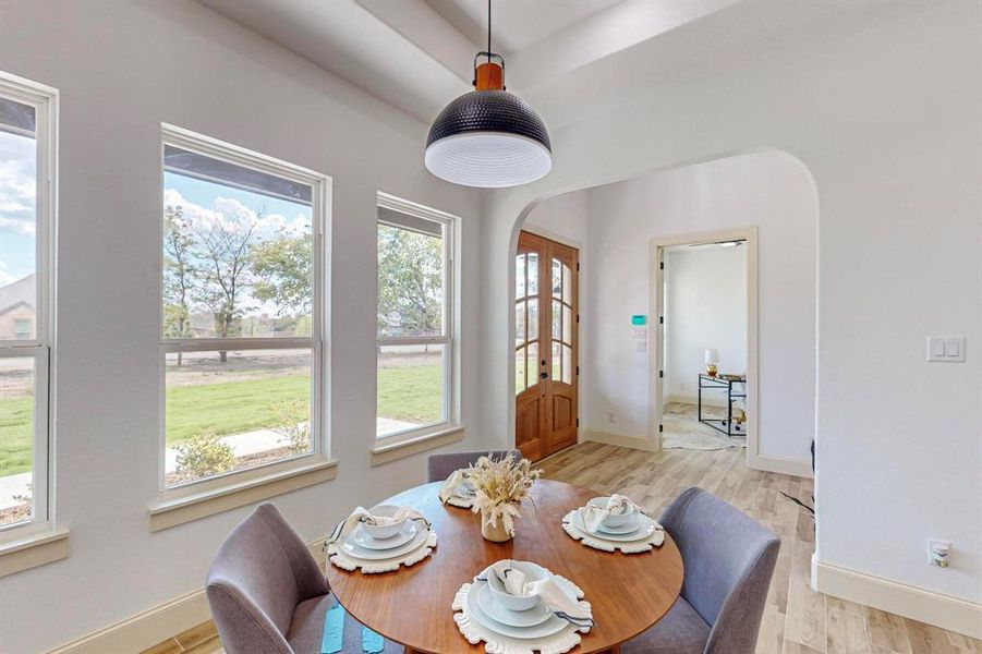 Dining area with light wood-type flooring