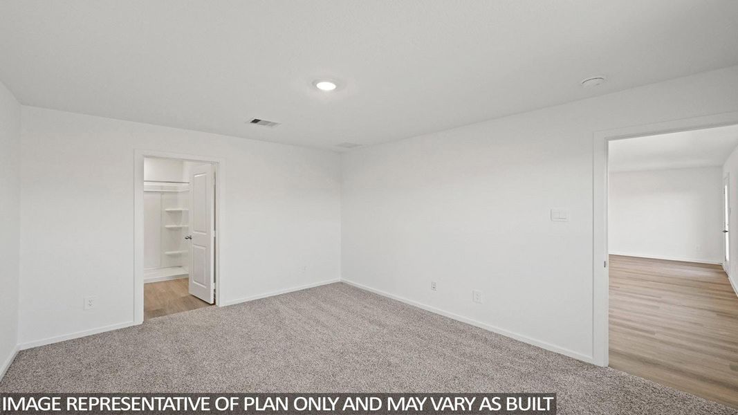 Unfurnished bedroom featuring light colored carpet and baseboards