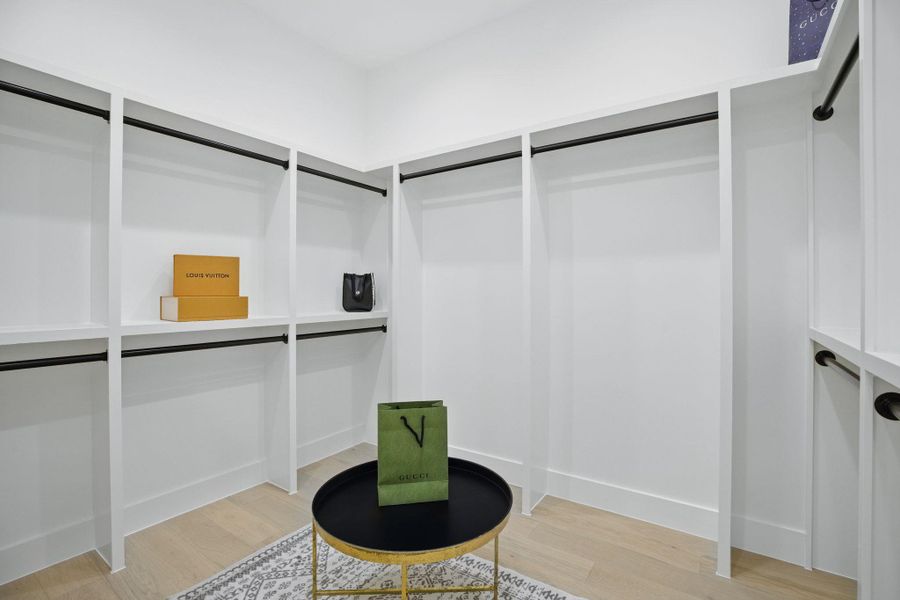 Walk in closet featuring light wood-style flooring