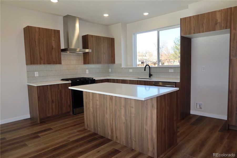 Upgraded kitchen, counters, backsplash and appliances.