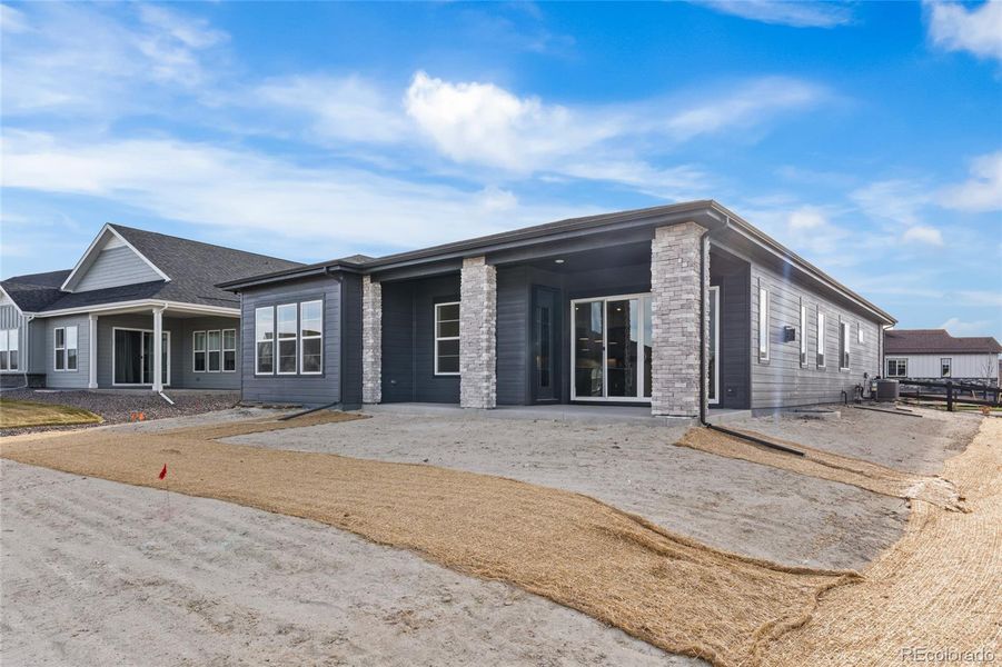 Exterior details and patio area of a home in Hilltop at Inspiration, Aurora (Image 4).
