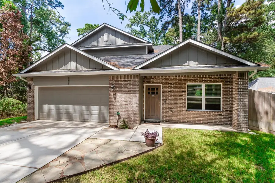 Front exterior of a new home in , Conroe, TX, highlighting curb appeal (Image 22).
