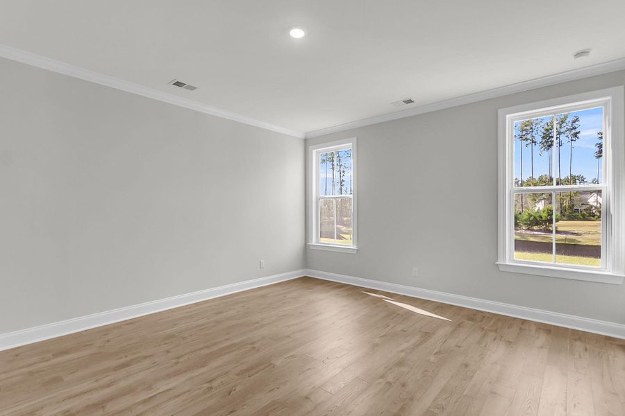 Spacious, unfurnished interior of a new home in Tidewater at Lakes of Cane Bay, Summerville (Image 17).