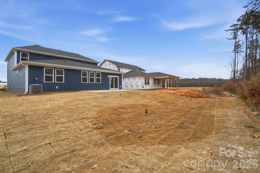 Exterior details and patio area of a home in Wellington Pointe Executive, Monroe (Image 27).