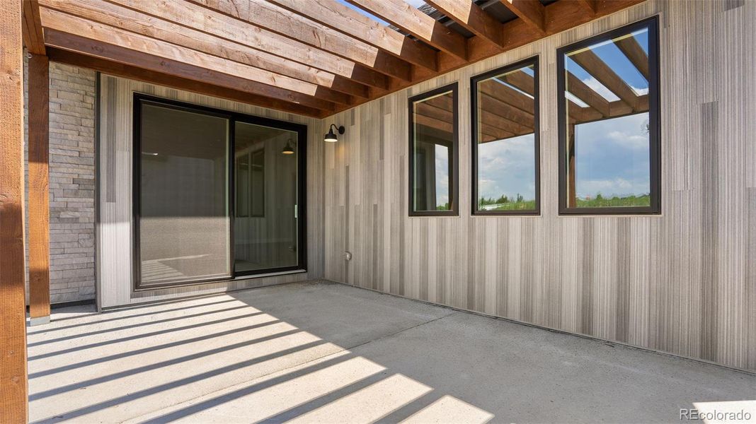 Exterior details and patio area of a home in Pelican Shores at Water Valley, Windsor (Image 3).