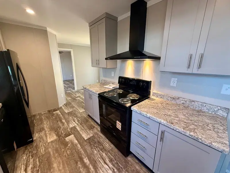 Furnished interior view inside a new home in , Pelican Bay (Image 7).