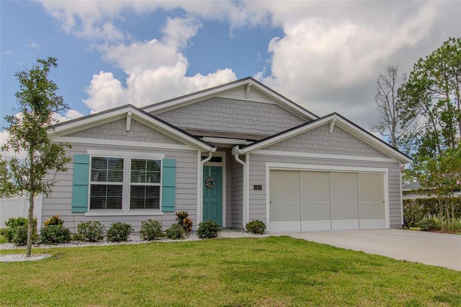 Front exterior of a new home in Palm Coast Homesites, Palm Coast, FL, highlighting curb appeal (Image 18).