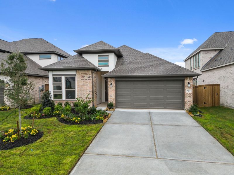 Front exterior of a new home in The Highlands, Porter, TX, highlighting curb appeal (Image 21).