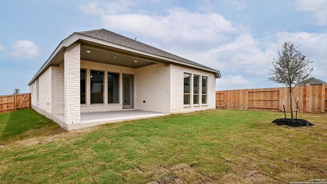 Front exterior of a new home in Homestead 55', Cibolo, TX, highlighting curb appeal (Image 2). Front exterior of a new home in Homestead 55', Cibolo, TX, highlighting curb appeal (Image 2).