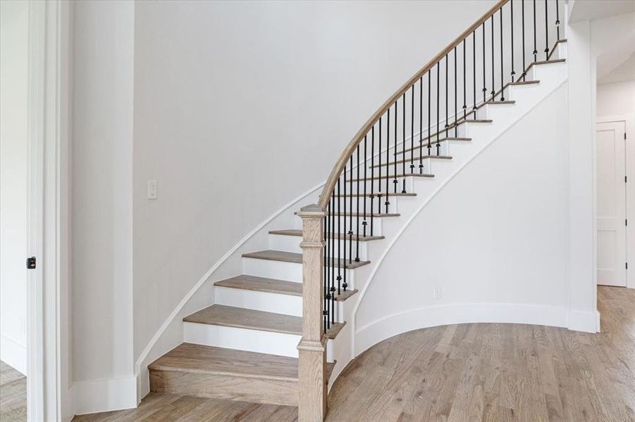 Stairs featuring wood-type flooring