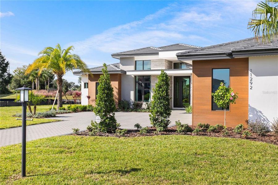 Front exterior of a new home in , Odessa, FL, highlighting curb appeal (Image 23).