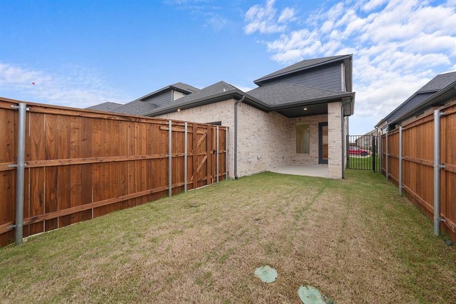 Exterior details and patio area of a home in Cottages of Celina, Celina (Image 4).