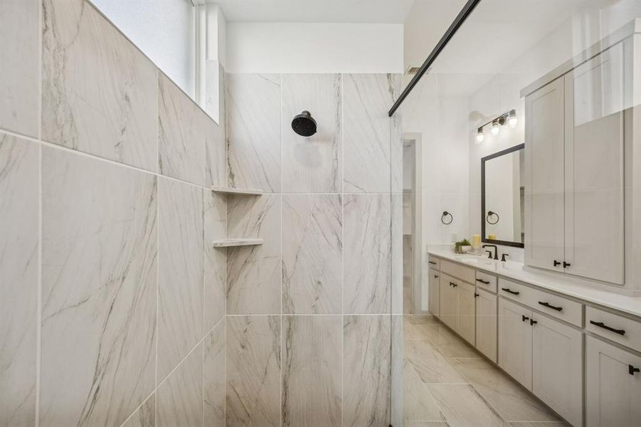 The spacious owner's bath walk in shower with drying area is the perfect place to start or end you day.