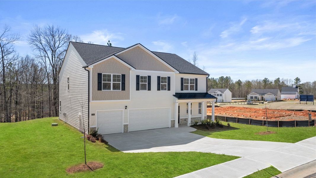 Front exterior of a new home in Brooks Station, Dacula, GA, highlighting curb appeal (Image 2).