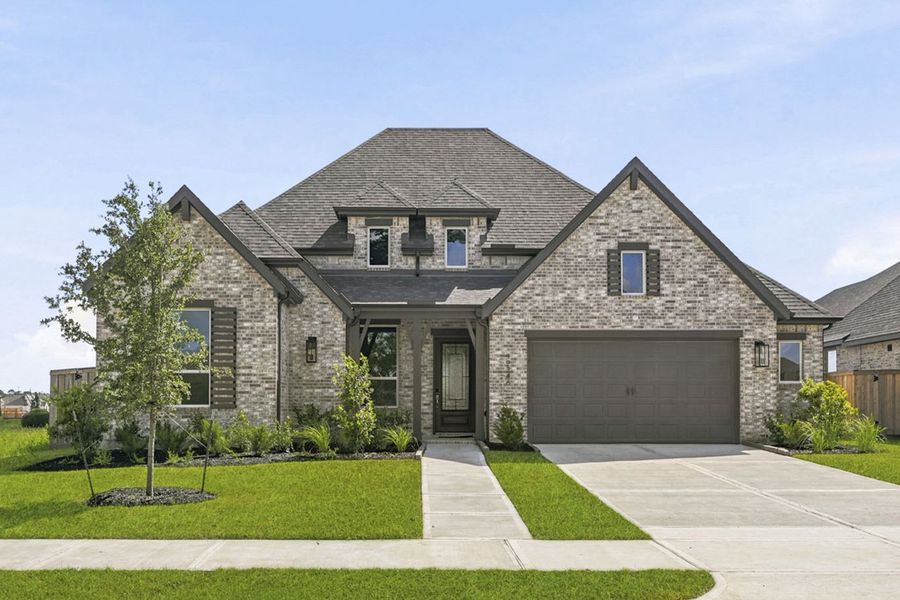Front exterior of a new home in Riceland, Mont Belvieu, TX, highlighting curb appeal (Image 1). Front exterior of a new home in Riceland, Mont Belvieu, TX, highlighting curb appeal (Image 1).