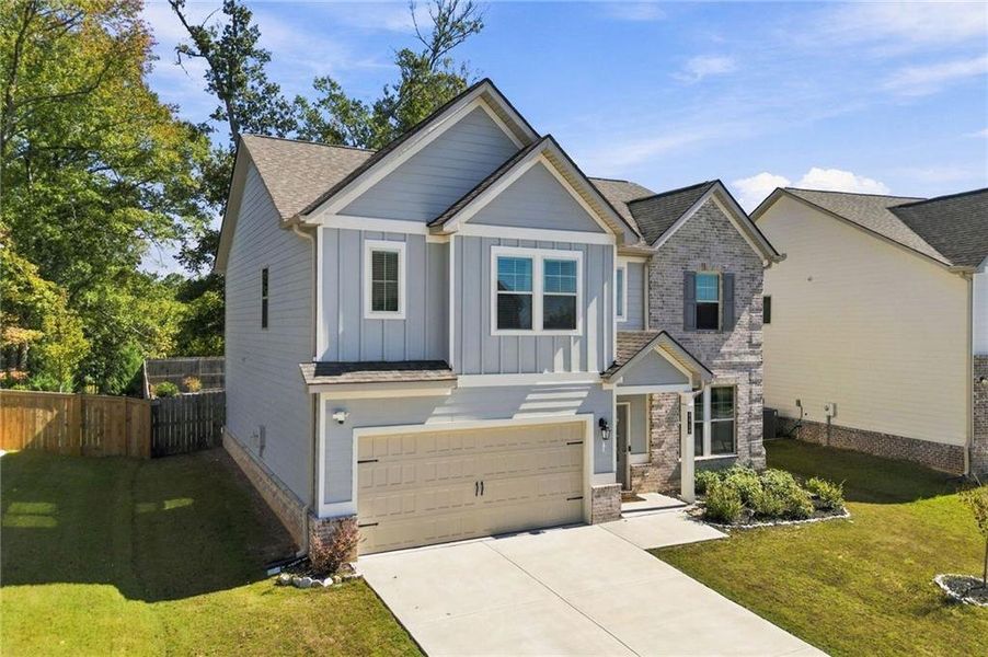 Front exterior of a new home in Dixon Farm, Fayetteville, GA, highlighting curb appeal (Image 2). Front exterior of a new home in Dixon Farm, Fayetteville, GA, highlighting curb appeal (Image 2).