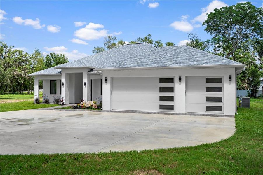 Front exterior of a new home in , New Port Richey, FL, highlighting curb appeal (Image 27).