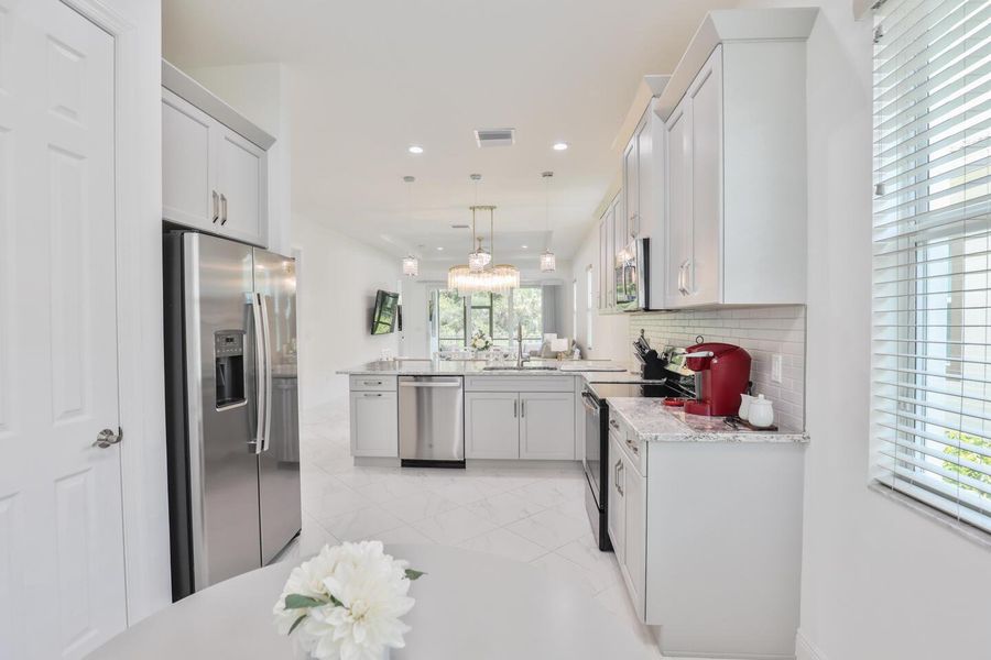 Furnished interior view inside a new home in PGA Village Verano, Port St. Lucie (Image 13).
