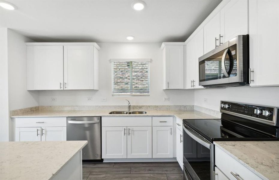 Airy kitchen with ample cabinet space *real home pictured