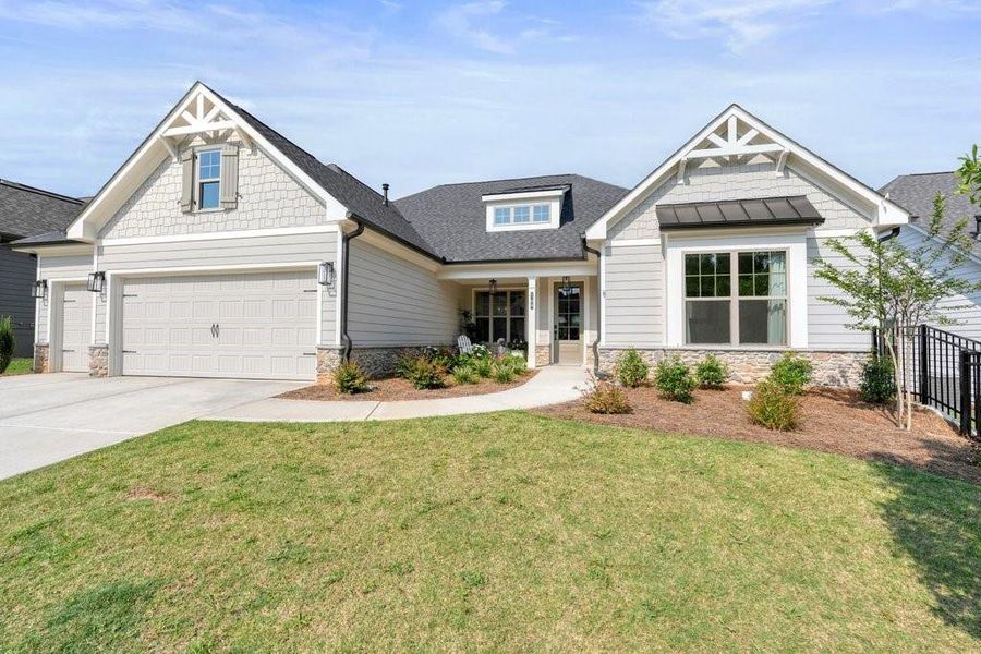 Front exterior of a new home in Soleil Belmont Park, Canton, GA, highlighting curb appeal (Image 2). Front exterior of a new home in Soleil Belmont Park, Canton, GA, highlighting curb appeal (Image 2).