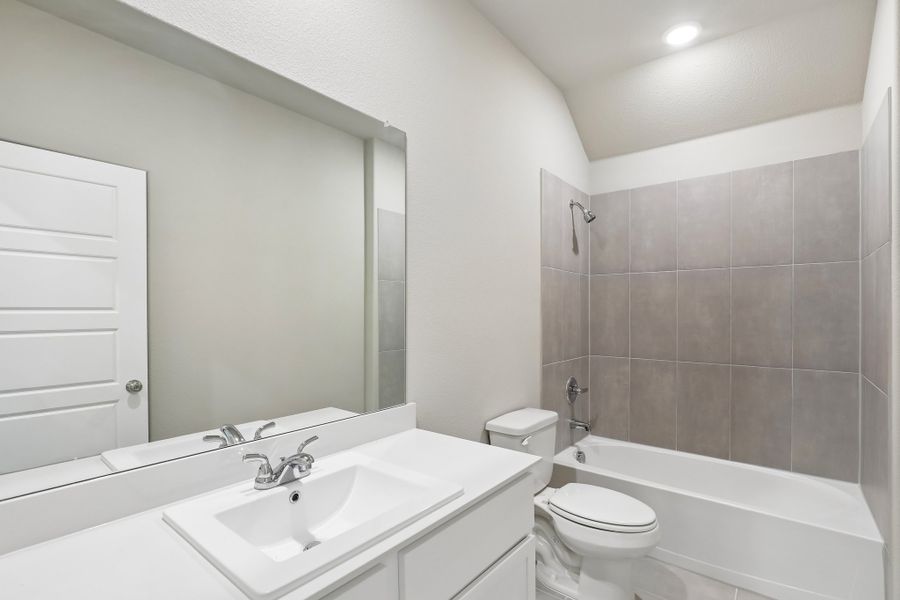 Secondary Bathroom in the Oscar home plan by Trophy Signature Homes