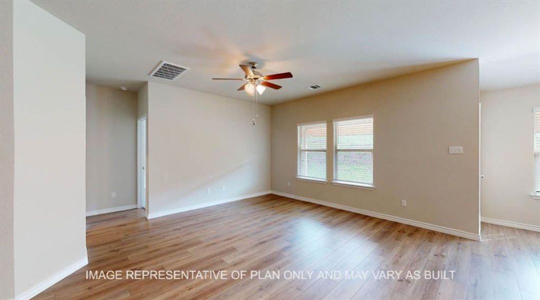 Unfurnished room with a ceiling fan, light wood finished floors, and baseboards Unfurnished room with a ceiling fan, light wood finished floors, and baseboards