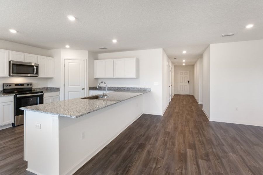 A kitchen with white cabinets. A kitchen with white cabinets.