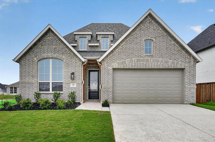 Front exterior of a new home in Wellington, Haslet, TX, highlighting curb appeal (Image 1). Front exterior of a new home in Wellington, Haslet, TX, highlighting curb appeal (Image 1).